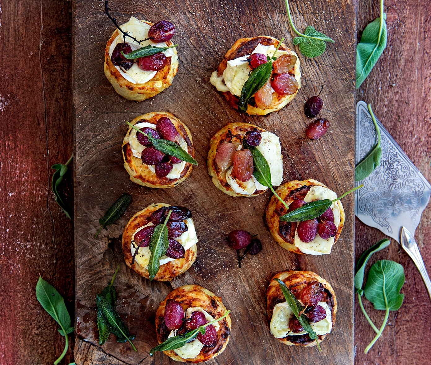 Gratins with Brie, roasted grapes, and crispy sage
