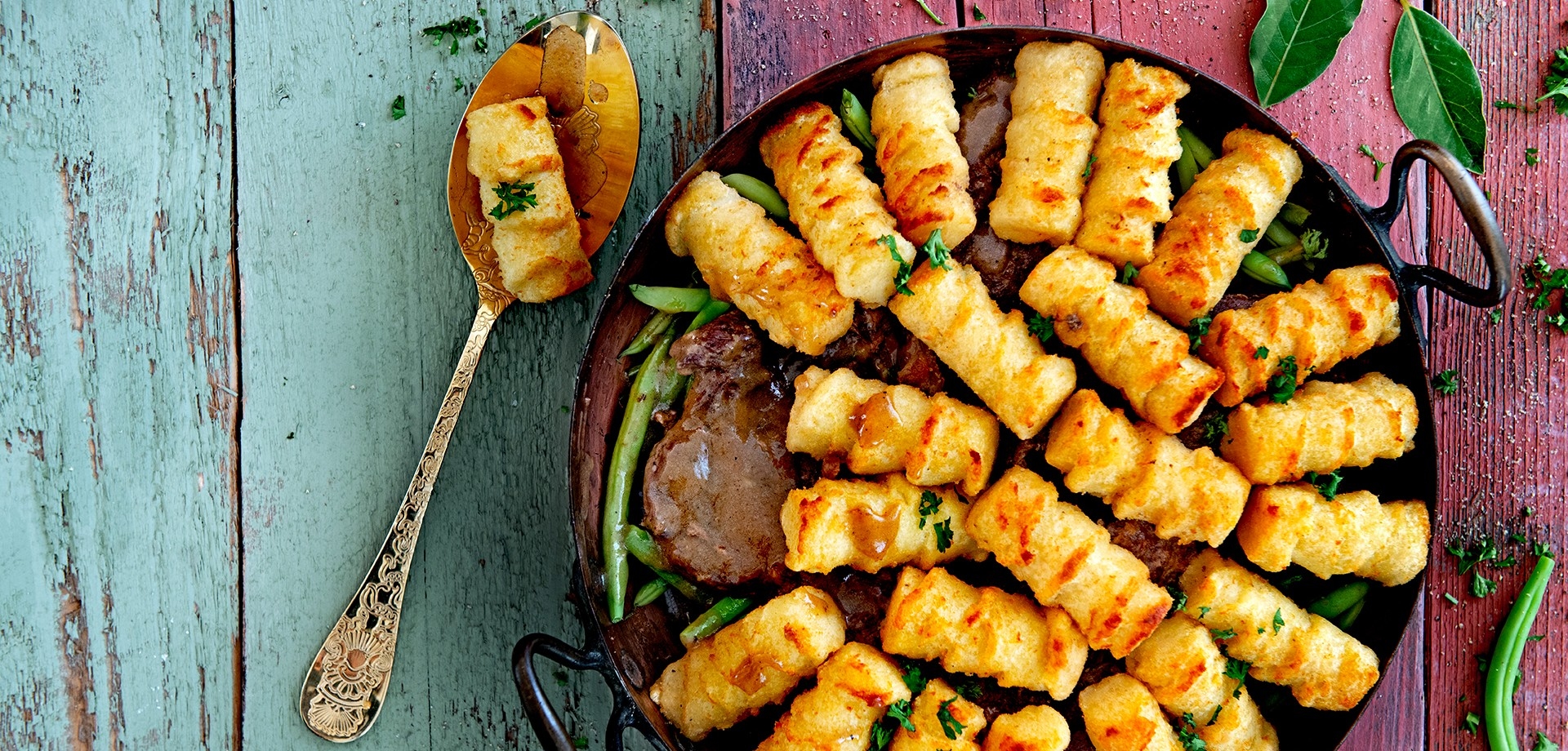 Laurel stew with green beans and potato croquette topping