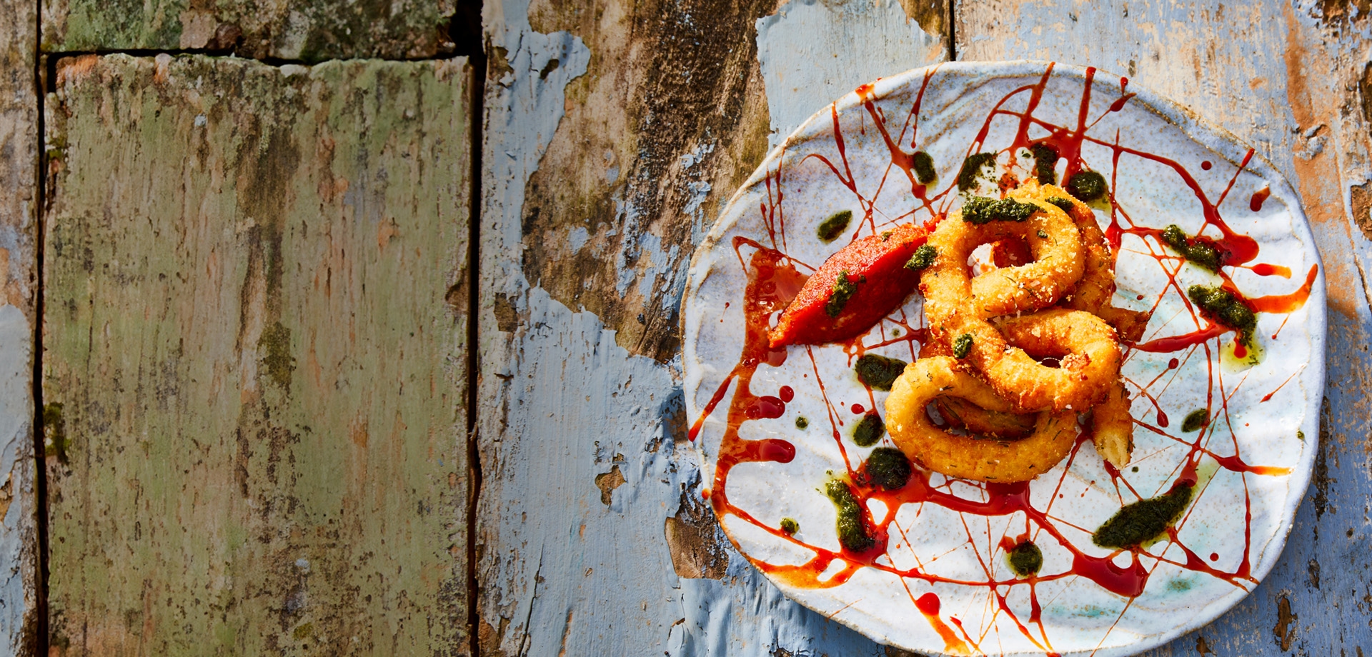 header_fishcake_churros_with_bell_pepper_reduction_and_herb_dressing